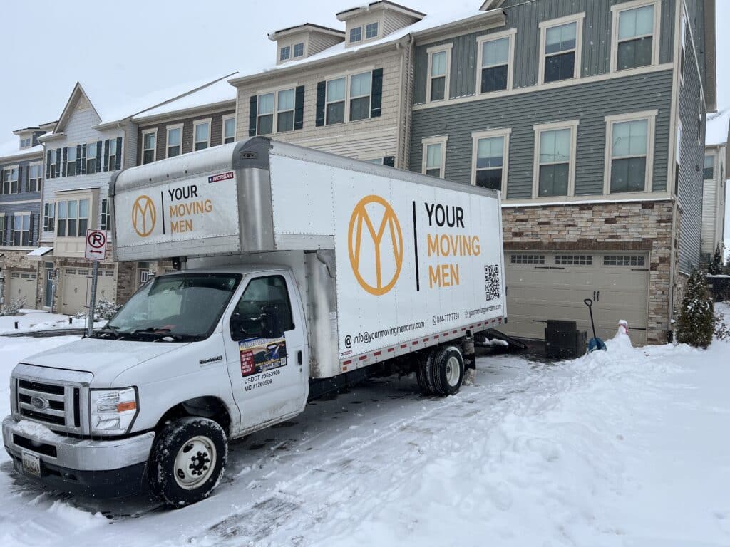 Your Moving Men truck providing DMV Moving Services in snow.